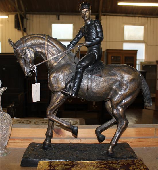 After Bonheur. A large bronze equestrian group of a jockey riding a horse, 24.5in.